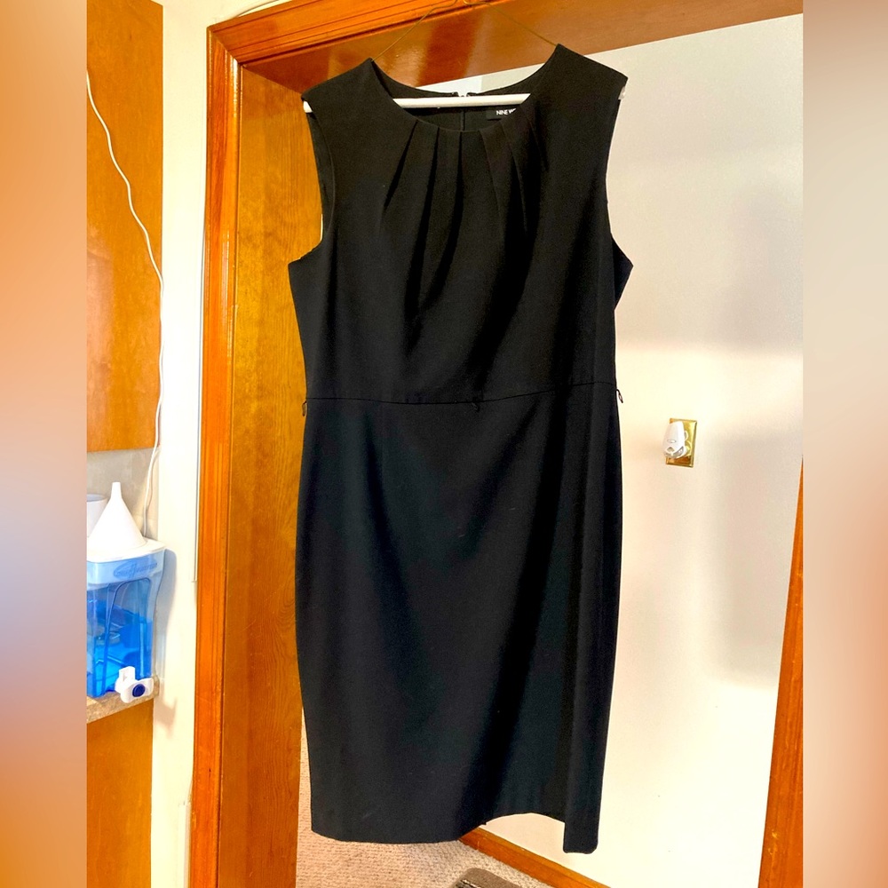 Pleated knee length little black dress